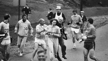 Jock Semple aims to extricate Kathrine Switzer from the 1967 Boston Marathon.